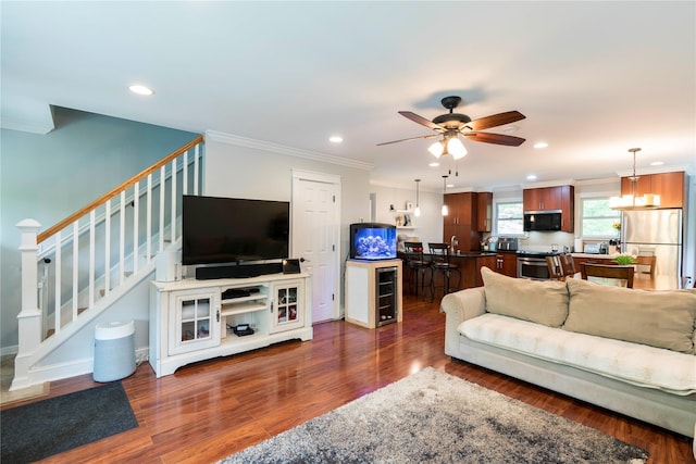 69 Taylor Rd, Patterson, NY 12563 - living room with ornamental molding, stairs, recessed lighting, dark wood-style flooring, and ceiling fan