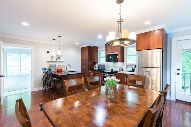 69 Taylor Rd, Patterson, NY 12563 - dining space featuring plenty of natural light, recessed lighting, baseboards, dark wood-style floors, and crown molding
