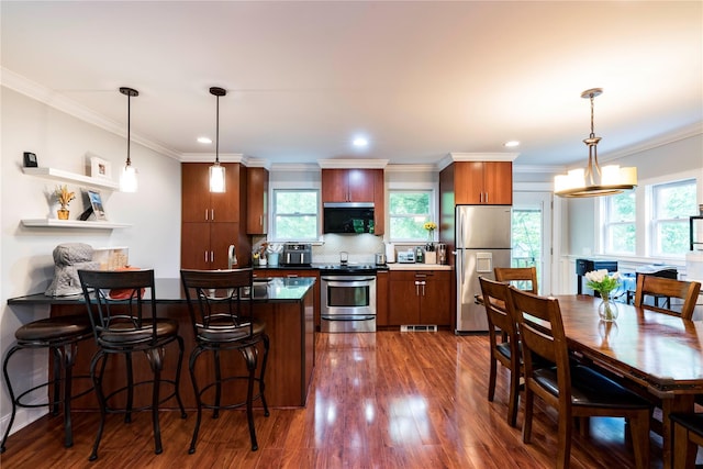 69 Taylor Rd, Patterson, NY 12563 - kitchen with stainless steel appliances, a peninsula, dark wood finished floors, backsplash, and dark countertops