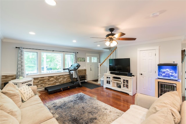 69 Taylor Rd, Patterson, NY 12563 - living area with crown molding, wood finished floors, a ceiling fan, stairway, and recessed lighting