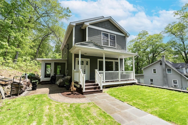 69 Taylor Rd, Patterson, NY 12563 - view of front of house featuring a front yard and a porch