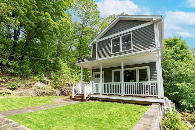 69 Taylor Rd, Patterson, NY 12563 - view of front of house with a porch and a front yard