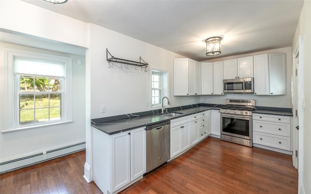 78 Closter Rd, Palisades, NY 10964 - kitchen featuring dark countertops, appliances with stainless steel finishes, a sink, and a baseboard radiator