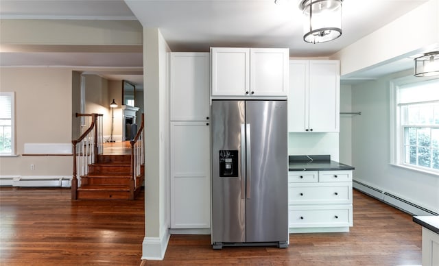 78 Closter Rd, Palisades, NY 10964 - kitchen with white cabinetry, dark countertops, a baseboard heating unit, and stainless steel fridge