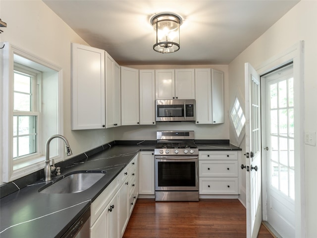 78 Closter Rd, Palisades, NY 10964 - kitchen with dark wood-type flooring, a sink, appliances with stainless steel finishes, and white cabinets