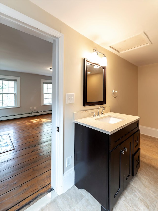 78 Closter Rd, Palisades, NY 10964 - bathroom with vanity, a baseboard radiator, baseboards, and wood finished floors