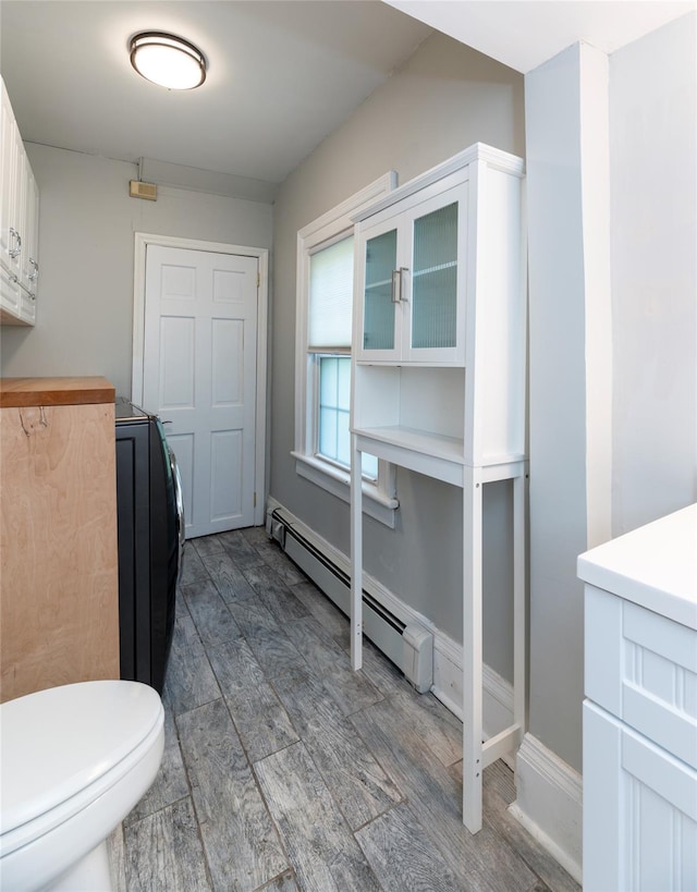78 Closter Rd, Palisades, NY 10964 - bathroom with wood finished floors, baseboard heating, and toilet