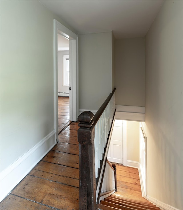 78 Closter Rd, Palisades, NY 10964 - staircase featuring baseboards, baseboard heating, and hardwood / wood-style floors