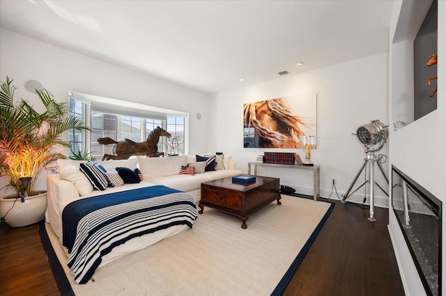 bedroom with visible vents, wood finished floors, and recessed lighting