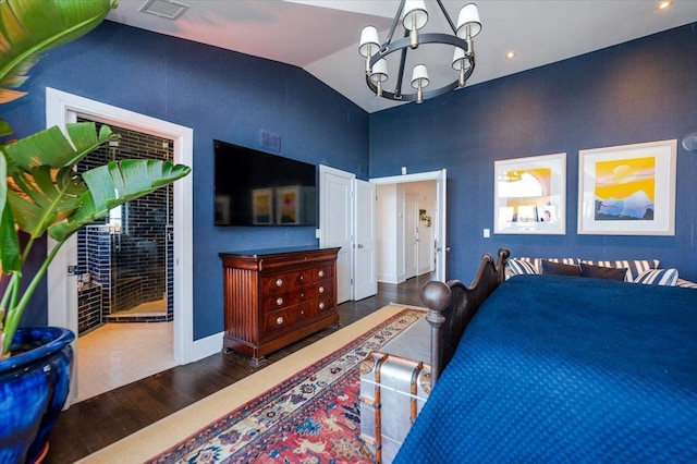 bedroom with visible vents, baseboards, a notable chandelier, wood finished floors, and high vaulted ceiling