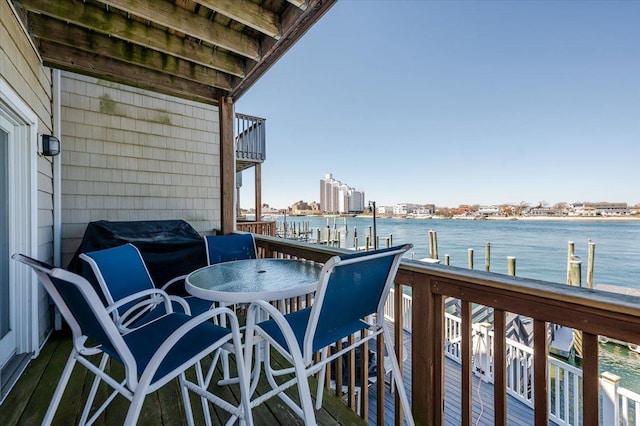 balcony featuring a water view