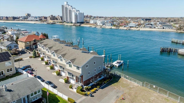 bird's eye view featuring a water view and a view of city