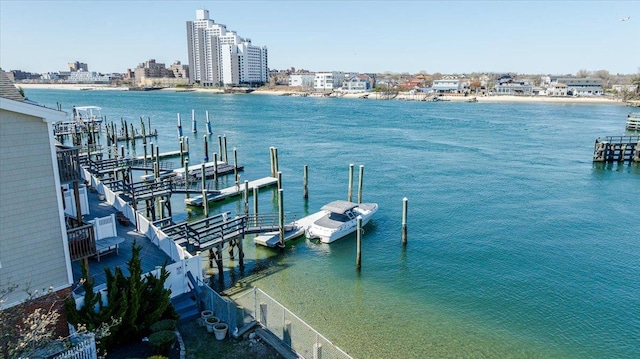 dock area with a city view and a water view