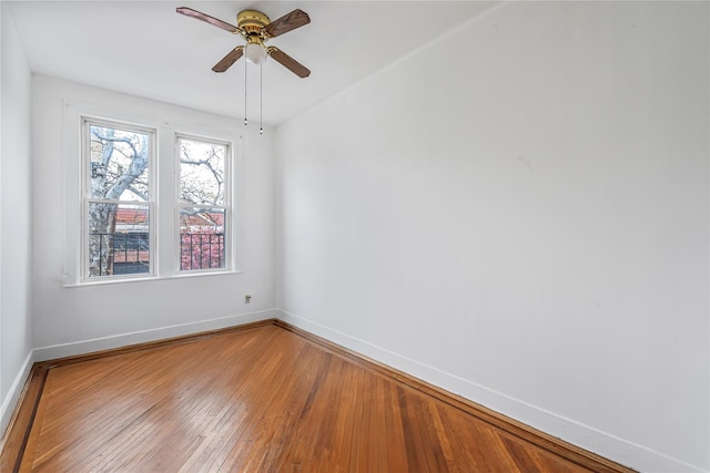 1816 21st Dr, Astoria, NY 11105 - unfurnished room with hardwood / wood-style floors, baseboards, and ceiling fan