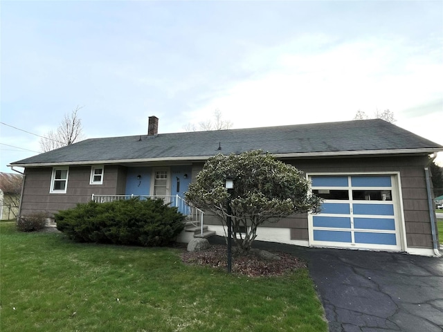 single story home featuring a front lawn, driveway, a chimney, an attached garage, and a shingled roof