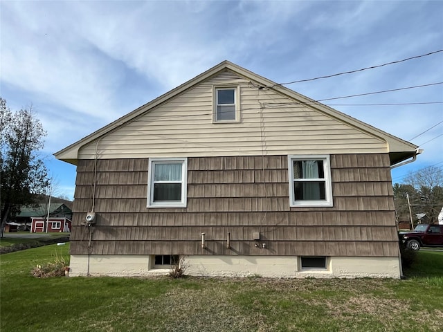 view of side of property with a yard