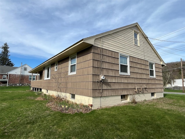 view of home's exterior featuring a yard