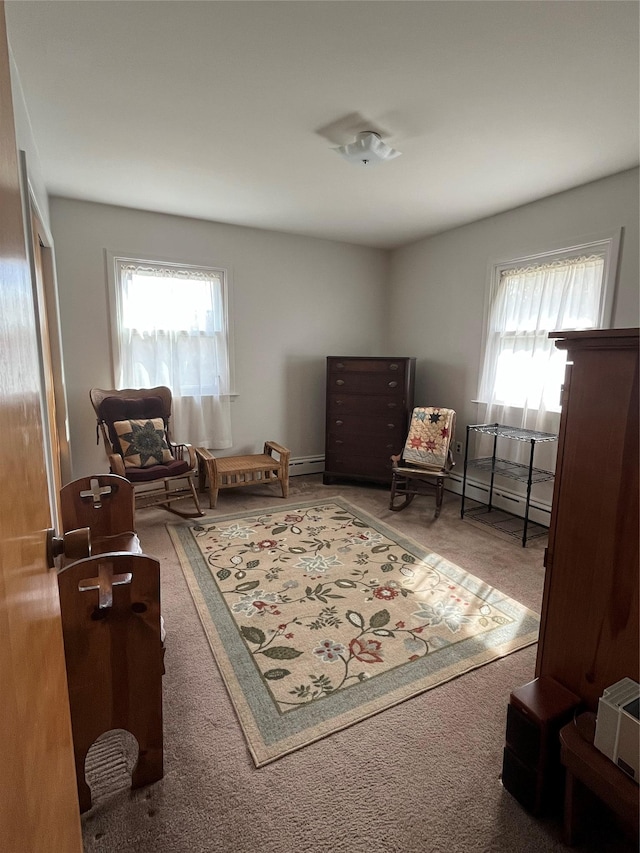 sitting room with a healthy amount of sunlight and carpet