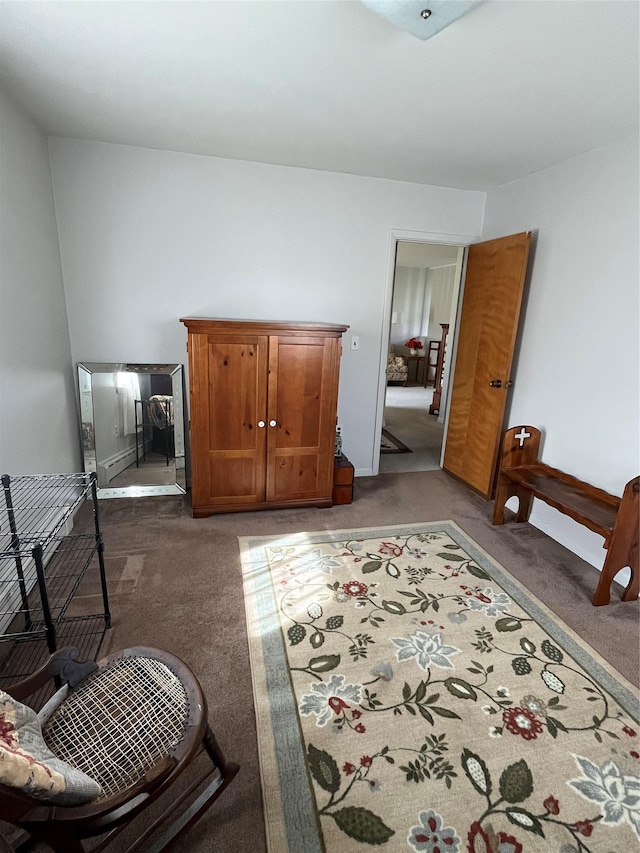 bedroom with light carpet and baseboards