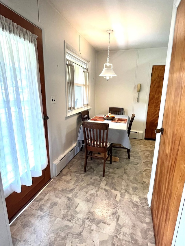 dining area with a baseboard heating unit and a baseboard radiator