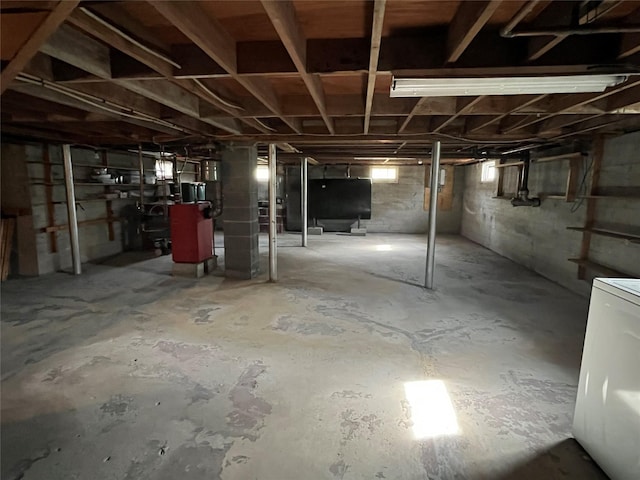 below grade area with washer / dryer and heating fuel