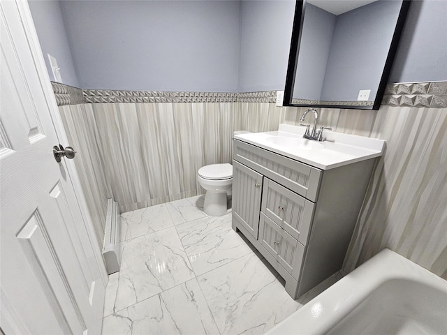 full bathroom with a wainscoted wall, toilet, vanity, and marble finish floor