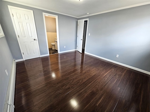 unfurnished bedroom with crown molding, ensuite bathroom, a baseboard heating unit, baseboards, and wood finished floors
