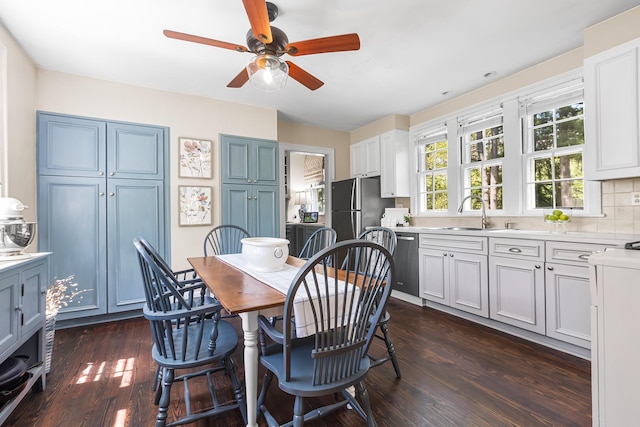 dining space featuring a ceiling fan and dark wood finished floors