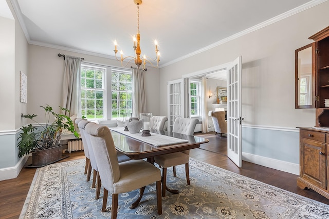 dining space with a chandelier, baseboards, french doors, dark wood-type flooring, and ornamental molding