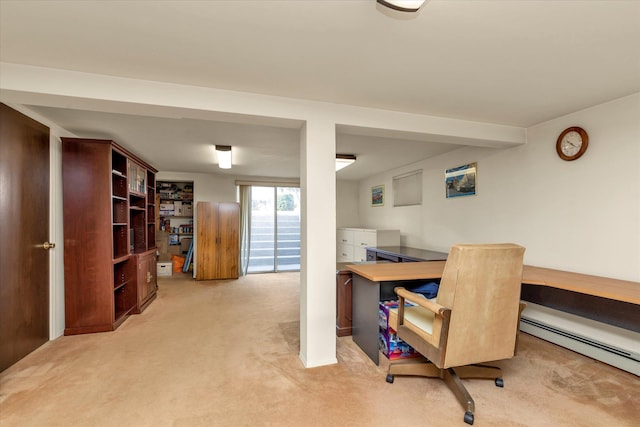 office area featuring a baseboard heating unit and light carpet