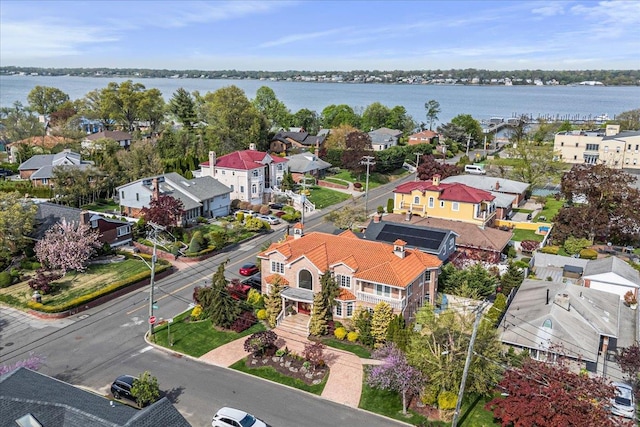 aerial view featuring a residential view and a water view