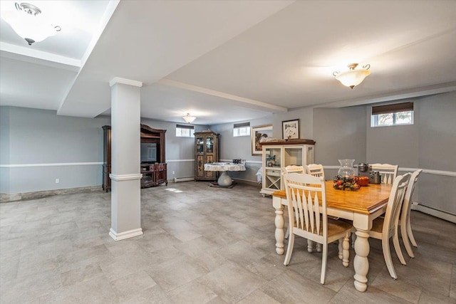 dining area featuring baseboards