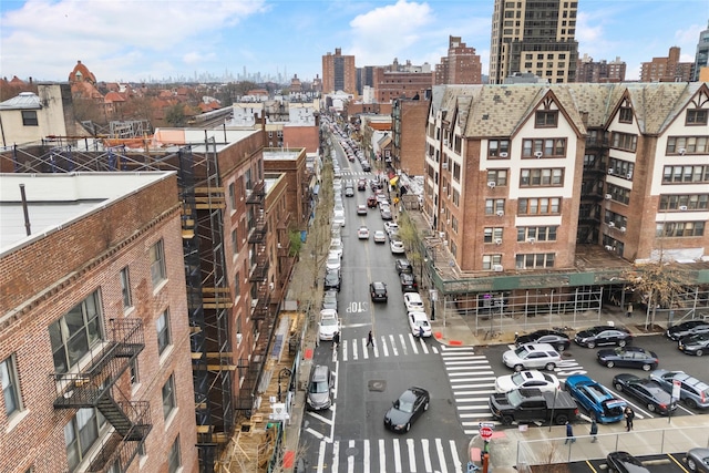 exterior space with a view of city and uncovered parking