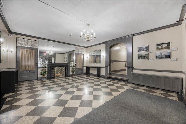 interior space with arched walkways, tile patterned floors, ornamental molding, baseboards, and a notable chandelier