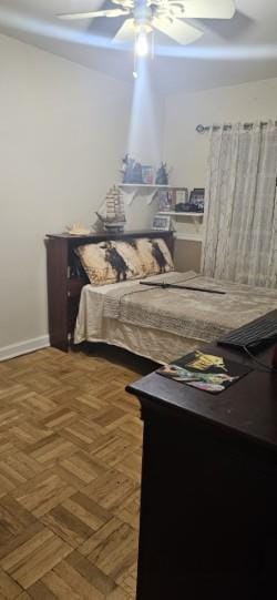 bedroom with baseboards and ceiling fan