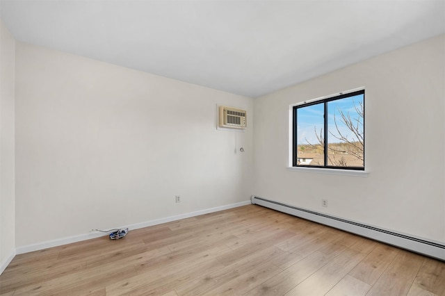 5 Fitzherbert Mews, Middletown, NY 10940 - empty room featuring light wood-style floors, a baseboard radiator, baseboards, and a wall unit AC