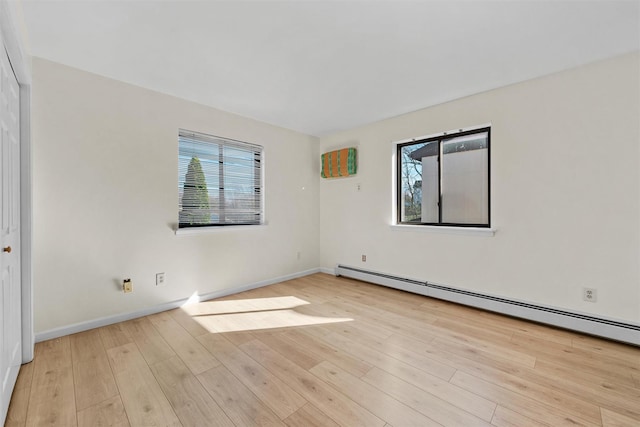 5 Fitzherbert Mews, Middletown, NY 10940 - unfurnished room featuring baseboards, plenty of natural light, wood finished floors, and a baseboard radiator