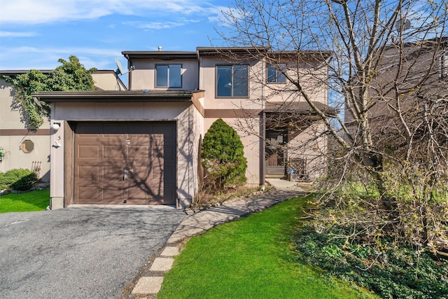 5 Fitzherbert Mews, Middletown, NY 10940 - traditional-style house with stucco siding, a garage, and aphalt driveway