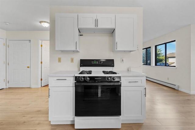 5 Fitzherbert Mews, Middletown, NY 10940 - kitchen with white cabinets, baseboard heating, light countertops, light wood-type flooring, and range with gas cooktop