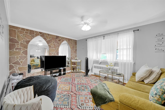 4415 Mundy Ln, Bronx, NY 10466 - living room featuring crown molding, ceiling fan, radiator, baseboards, and arched walkways