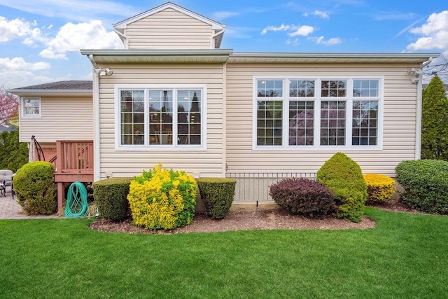 view of home's exterior with a lawn
