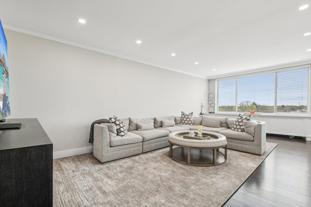 living area featuring recessed lighting, wood finished floors, crown molding, and baseboards