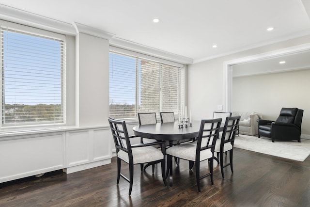 dining room featuring a decorative wall, dark wood-style flooring, a wainscoted wall, and recessed lighting