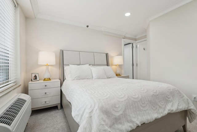 carpeted bedroom with a wall mounted AC, recessed lighting, and crown molding