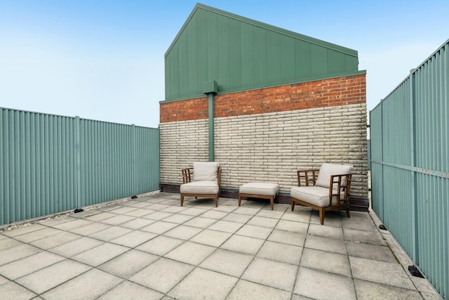 view of patio / terrace featuring fence