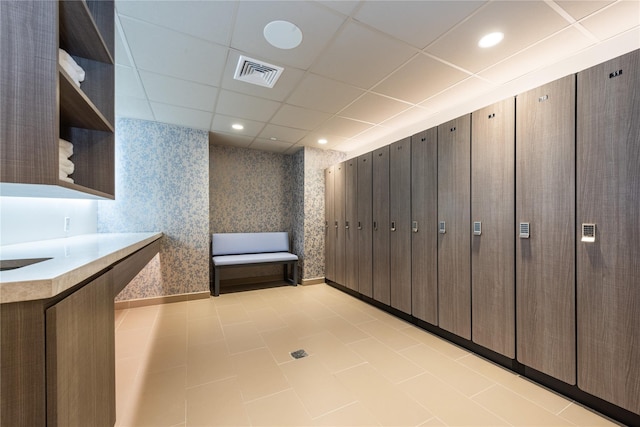 interior space with wallpapered walls and visible vents