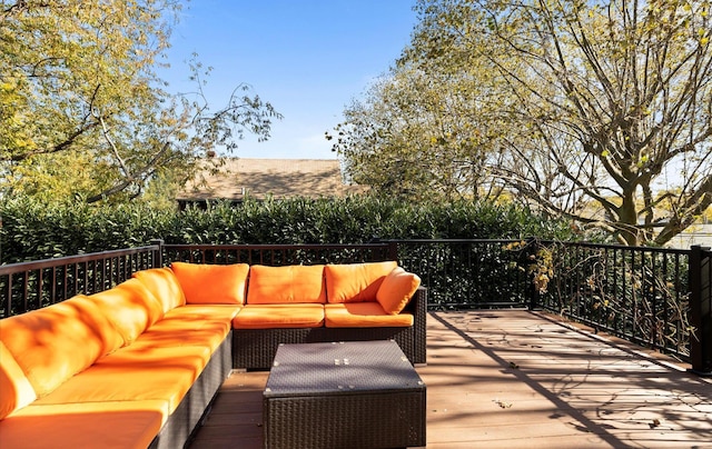 wooden terrace with an outdoor hangout area