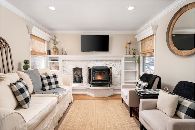 living area with crown molding, wood finished floors, and recessed lighting