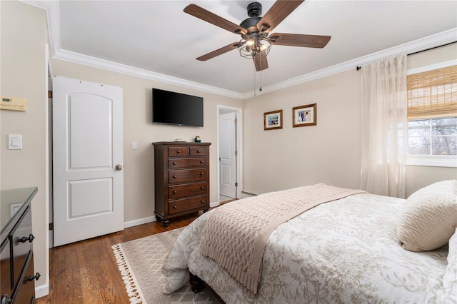 bedroom featuring baseboard heating, dark wood-style flooring, crown molding, and baseboards