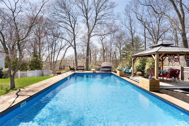 view of swimming pool featuring a gazebo, a fenced in pool, a patio, and fence
